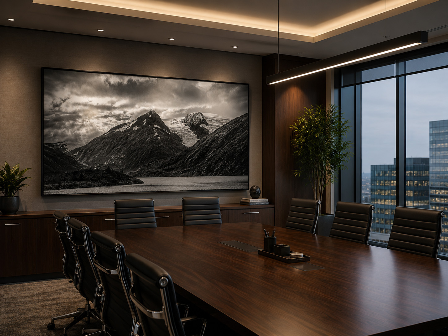 Large black and white mountain artwork in an executive conference room by Dan Sproul